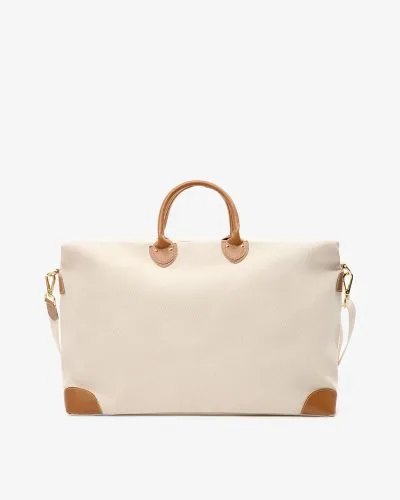 Stor reiseveske i off white bomullscanvas med detaljer i lysebrunt skinn